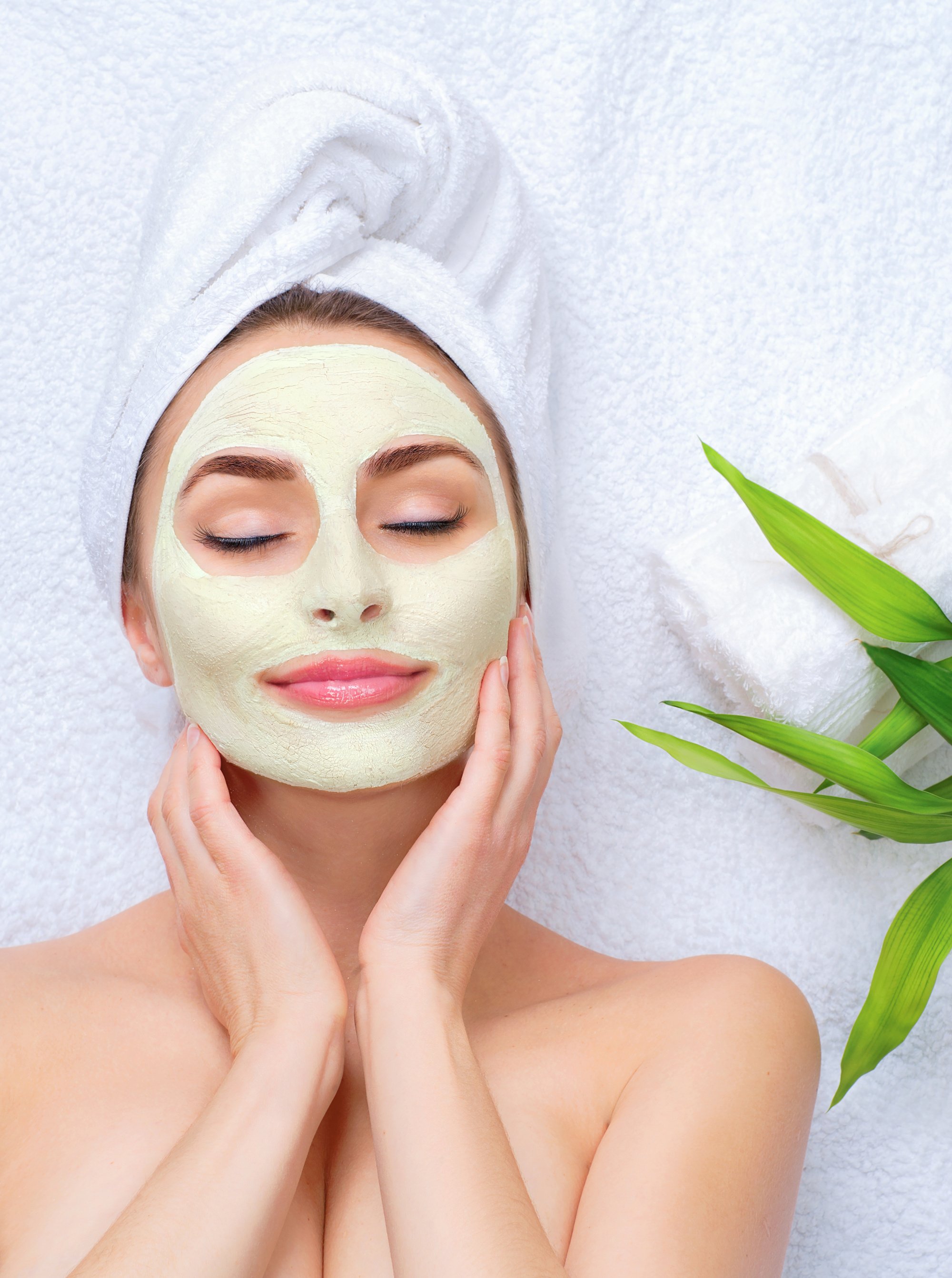 Spa Woman Applying Facial Mask 